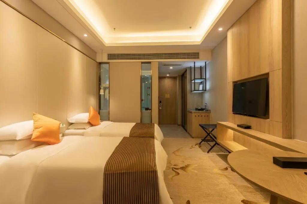 Bed in Dezhou Regal Kangbo Hotel