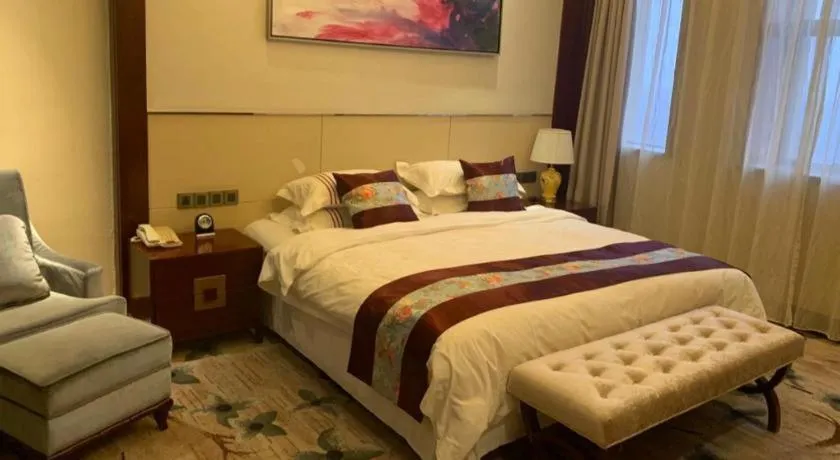 Bed in Dezhou Regal Kangbo Hotel