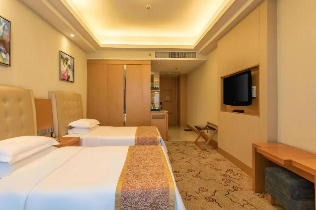 Bed in Dezhou Regal Kangbo Hotel