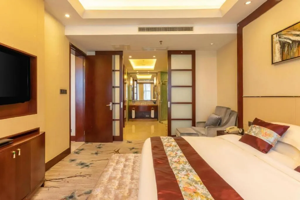 Bed in Dezhou Regal Kangbo Hotel