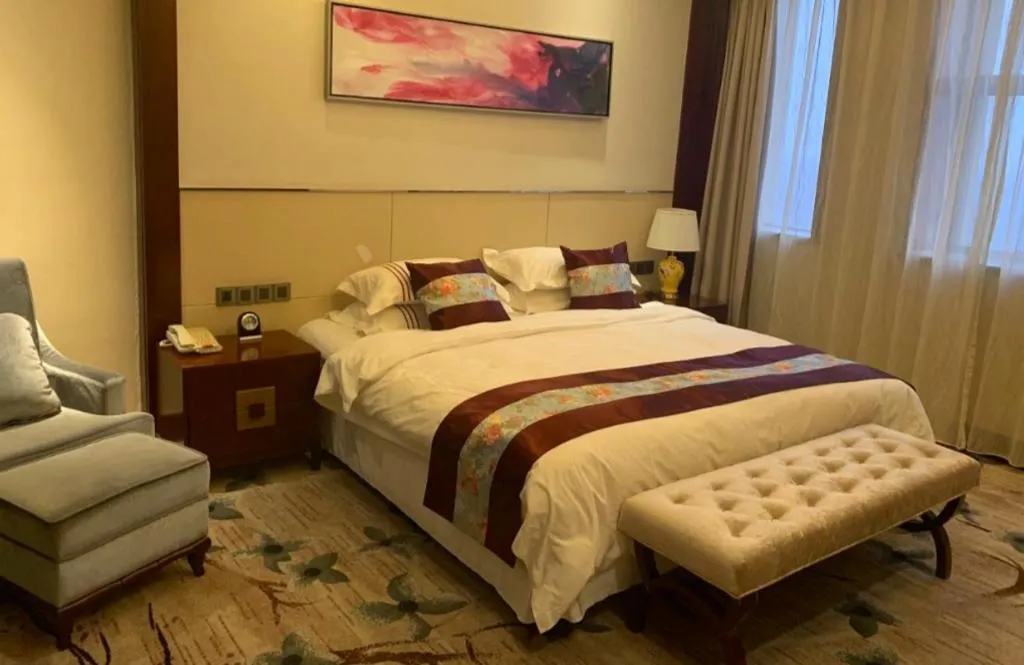 Bed in Dezhou Regal Kangbo Hotel