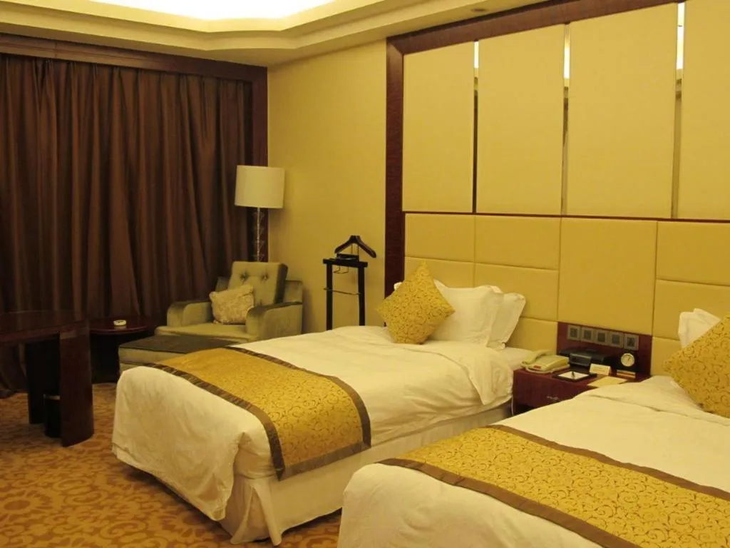 Bed in Dezhou Regal Kangbo Hotel