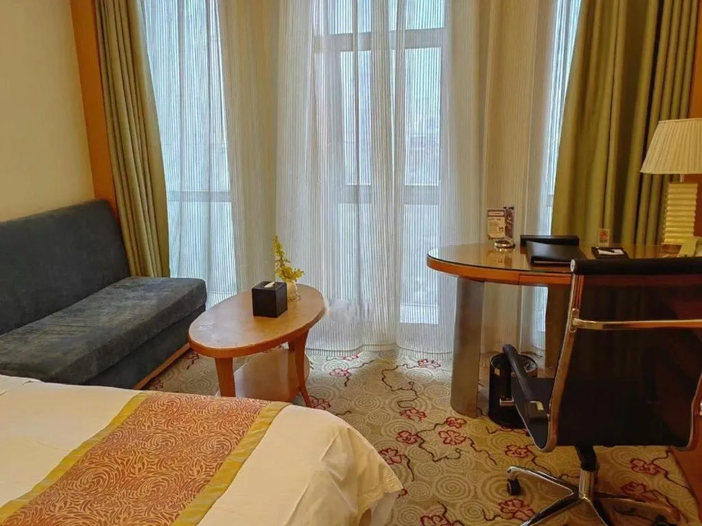 Bed in Dezhou Regal Kangbo Hotel