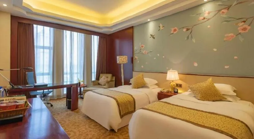 Bed in Dezhou Regal Kangbo Hotel