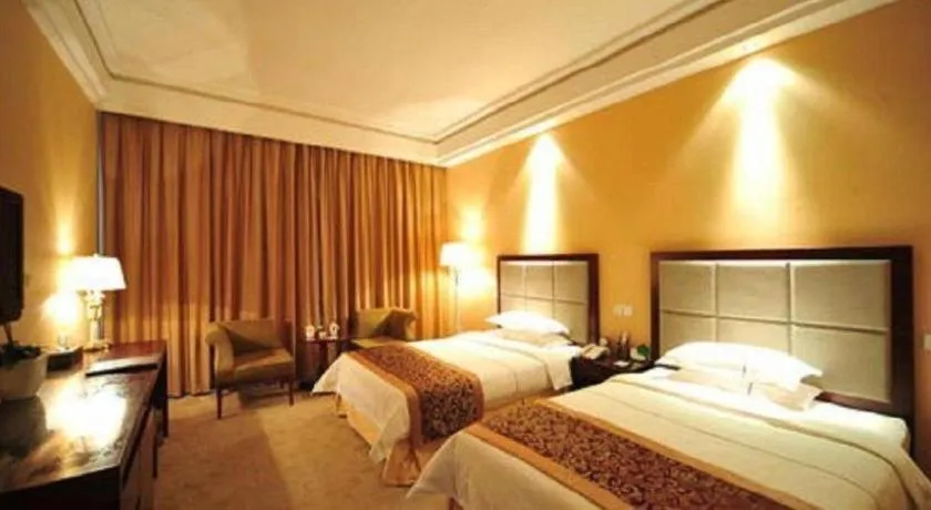 Bed in Dezhou Regal Kangbo Hotel