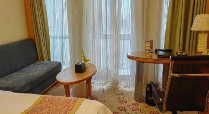 Bed in Dezhou Regal Kangbo Hotel