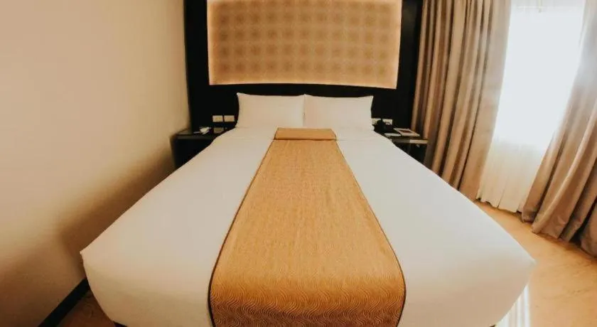 Bed in Grand Xing Imperial Hotel