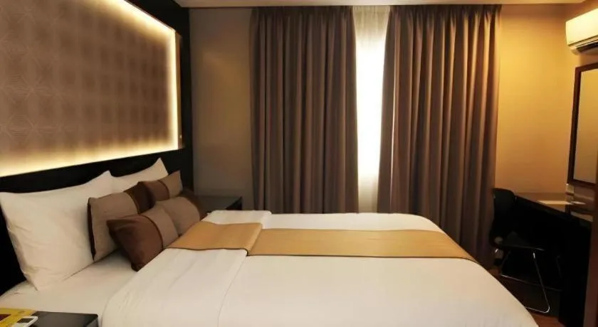 Bed in Grand Xing Imperial Hotel