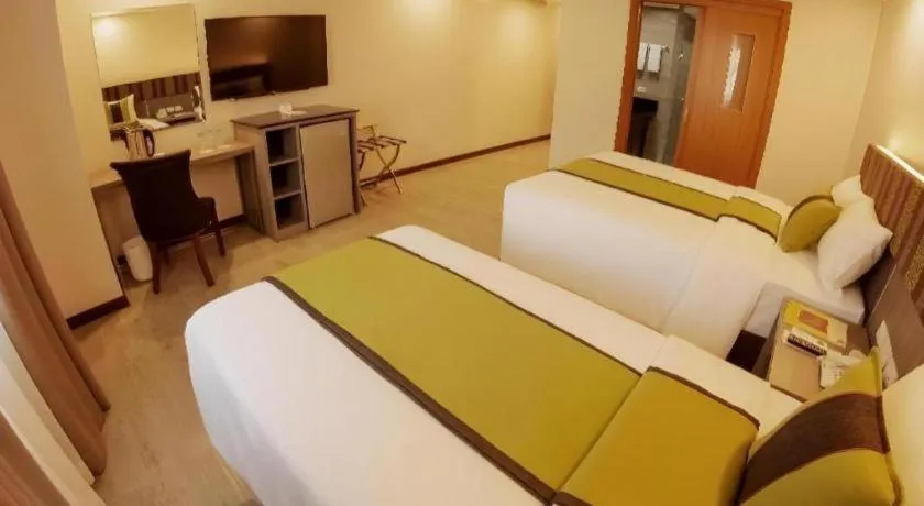 Bed in Grand Xing Imperial Hotel