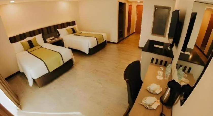 Bed in Grand Xing Imperial Hotel