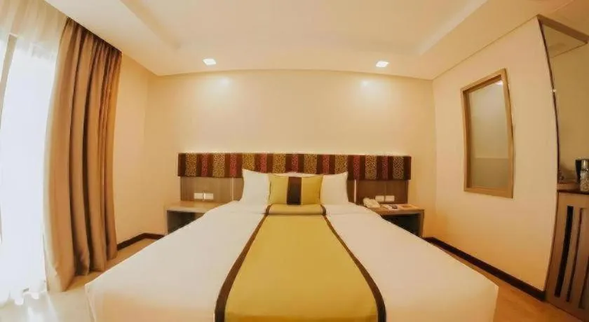 Bed in Grand Xing Imperial Hotel