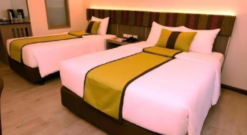 Bed in Grand Xing Imperial Hotel