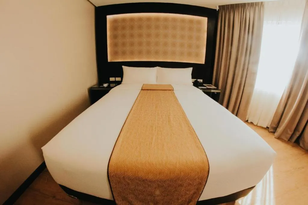 Bed in Grand Xing Imperial Hotel
