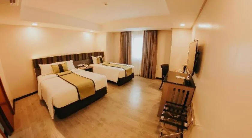 Bed in Grand Xing Imperial Hotel