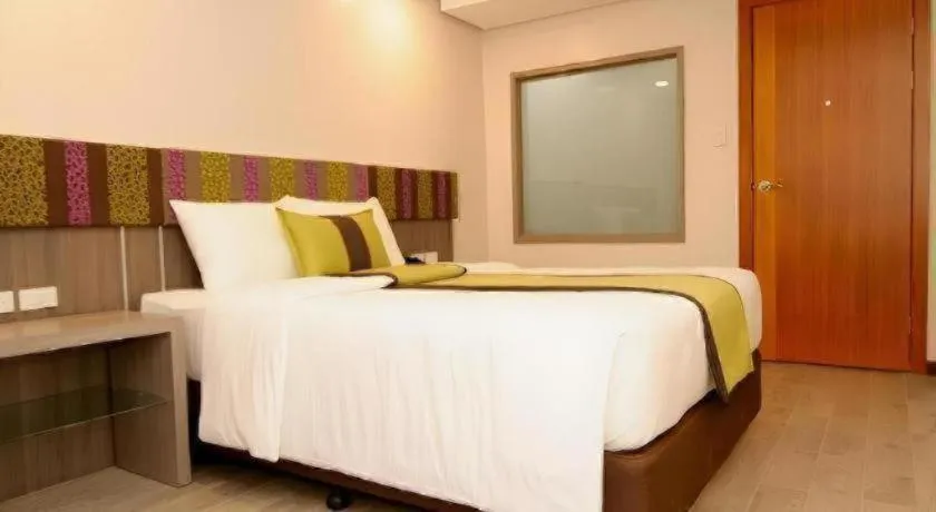 Bed in Grand Xing Imperial Hotel