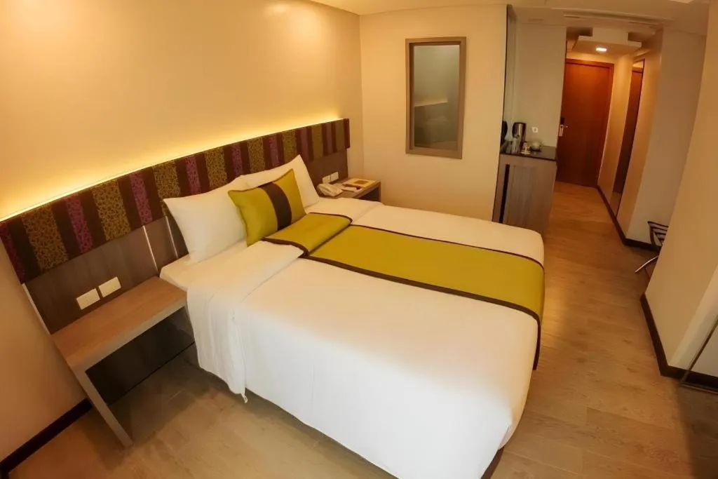 Bed in Grand Xing Imperial Hotel