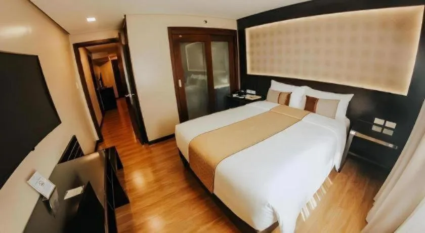 Bed in Grand Xing Imperial Hotel