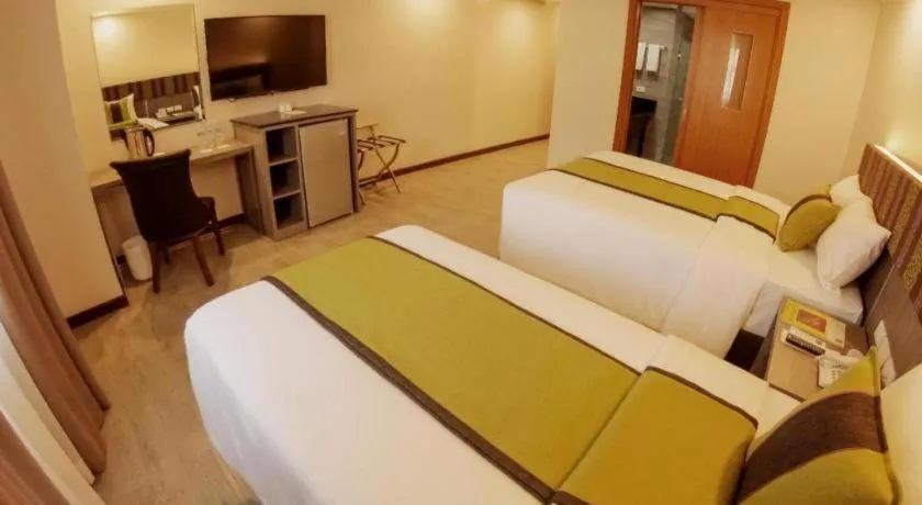 Bed in Grand Xing Imperial Hotel