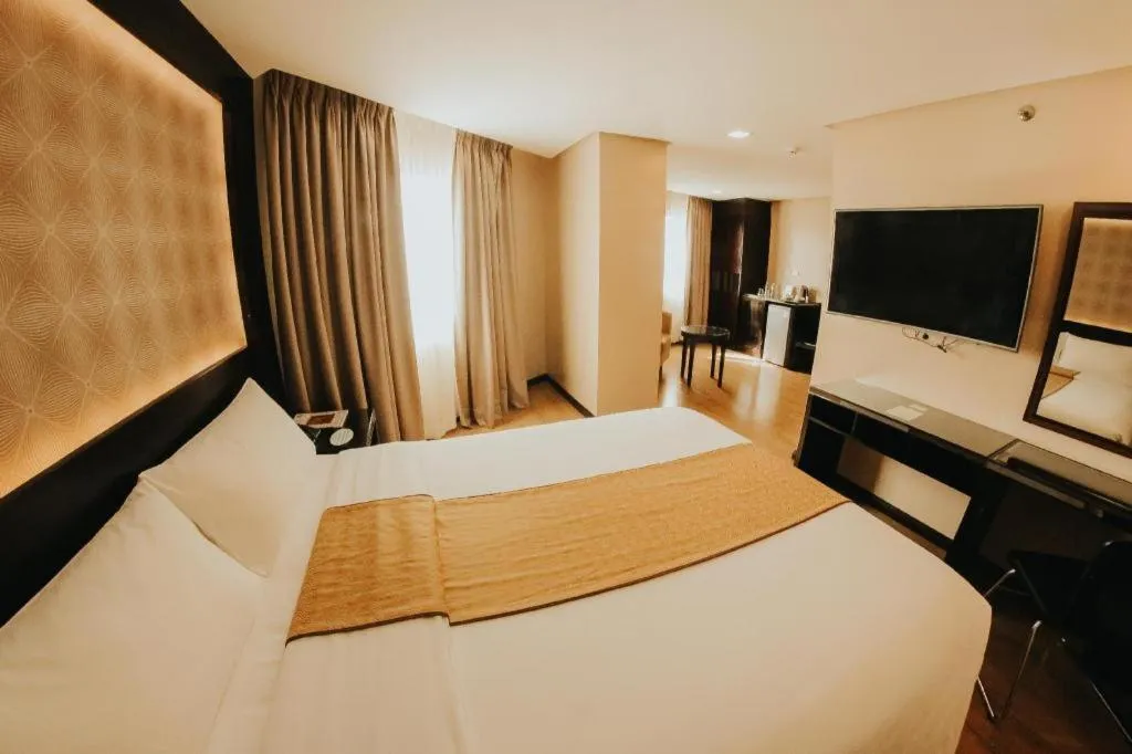 Bed in Grand Xing Imperial Hotel