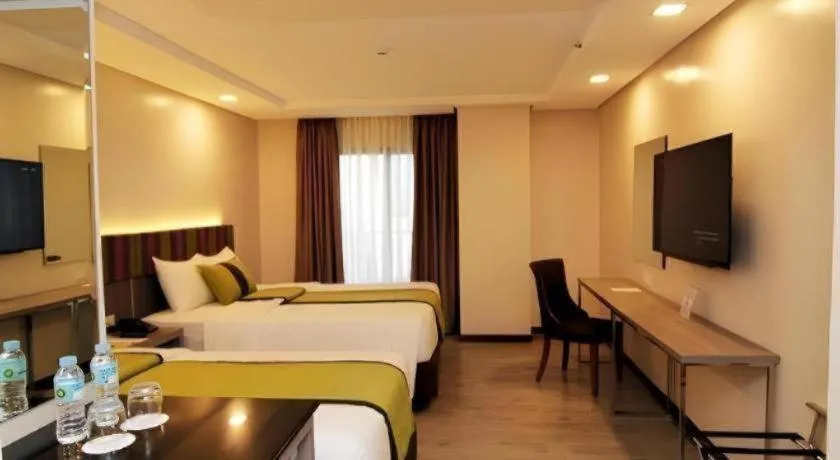 Bed in Grand Xing Imperial Hotel