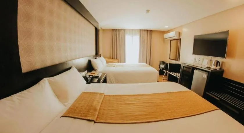 Bed in Grand Xing Imperial Hotel