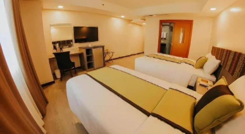 Bed in Grand Xing Imperial Hotel