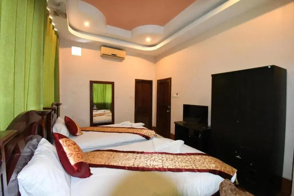 Bed in PXT Hotel Bed in PXT Hotel