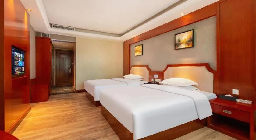 Bed in Borrman Hotel Guangzhou Tianhe Tangdong Subway Station Convention and Exhibition Center