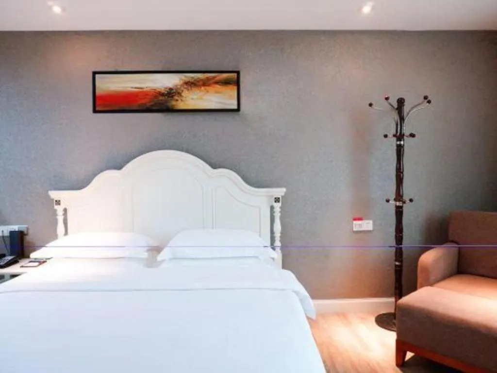 Bed in Borrman Hotel Guangzhou Tianhe Tangdong Subway Station Convention and Exhibition Center