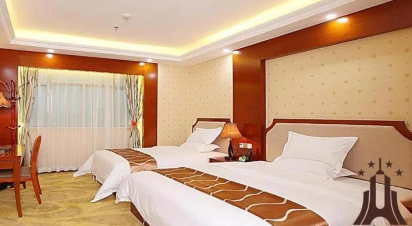 Bed in Borrman Hotel Guangzhou Tianhe Tangdong Subway Station Convention and Exhibition Center