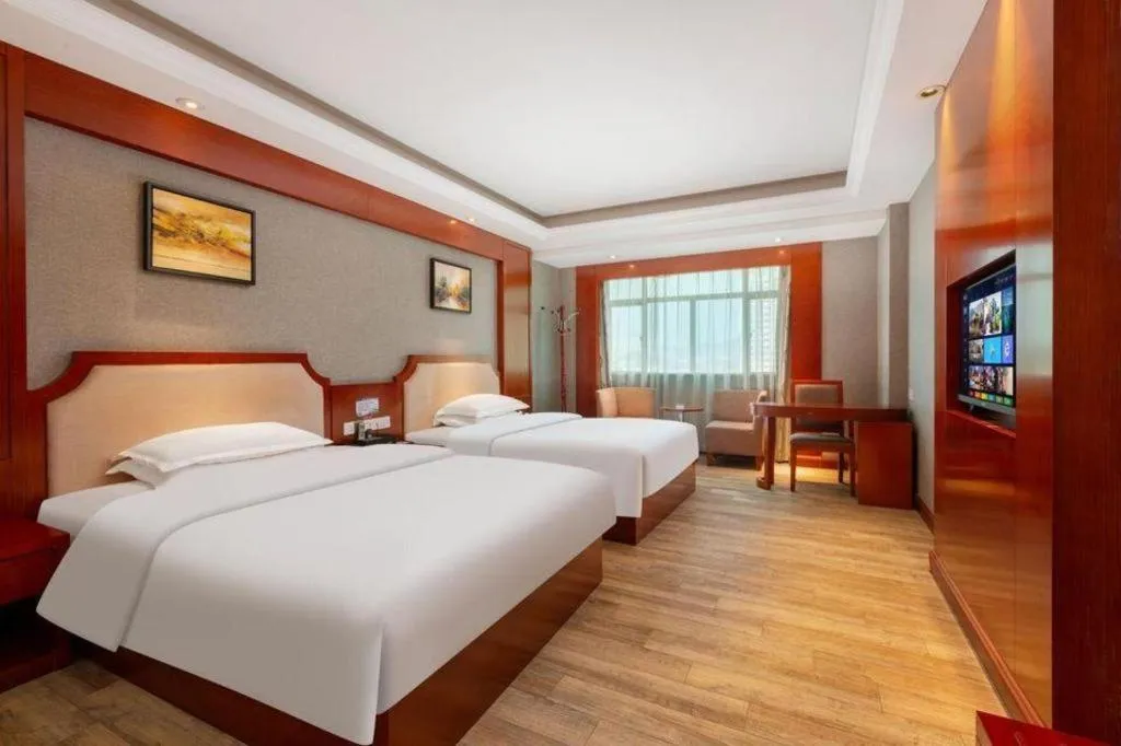 Bed in Borrman Hotel Guangzhou Tianhe Tangdong Subway Station Convention and Exhibition Center