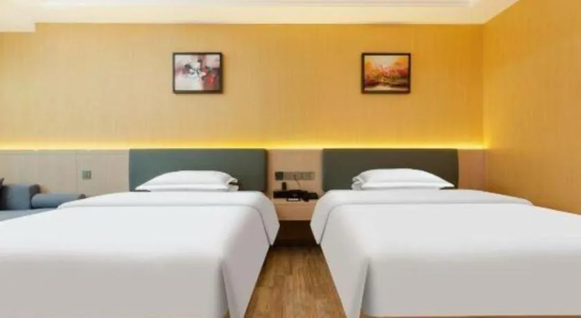 Bed in Borrman Hotel Guangzhou Tianhe Tangdong Subway Station Convention and Exhibition Center