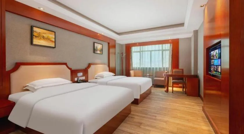 Bed in Borrman Hotel Guangzhou Tianhe Tangdong Subway Station Convention and Exhibition Center