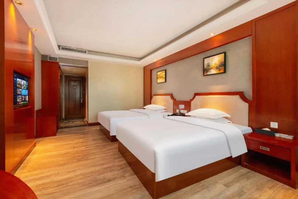 Bed in Borrman Hotel Guangzhou Tianhe Tangdong Subway Station Convention and Exhibition Center