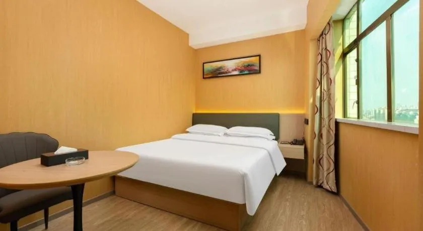 Bed in Borrman Hotel Guangzhou Tianhe Tangdong Subway Station Convention and Exhibition Center