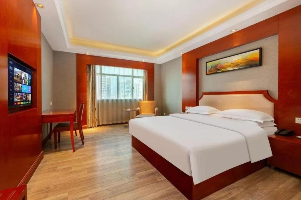 Bed in Borrman Hotel Guangzhou Tianhe Tangdong Subway Station Convention and Exhibition Center