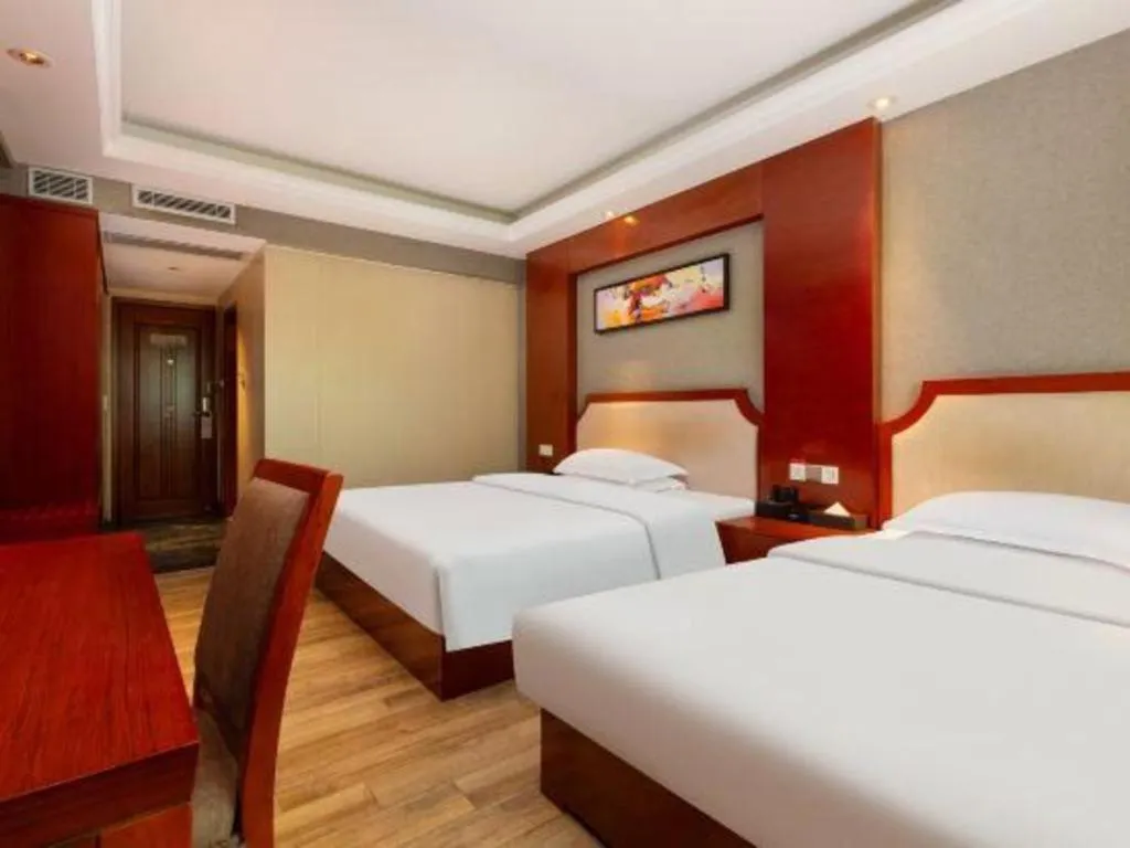 Bed in Borrman Hotel Guangzhou Tianhe Tangdong Subway Station Convention and Exhibition Center