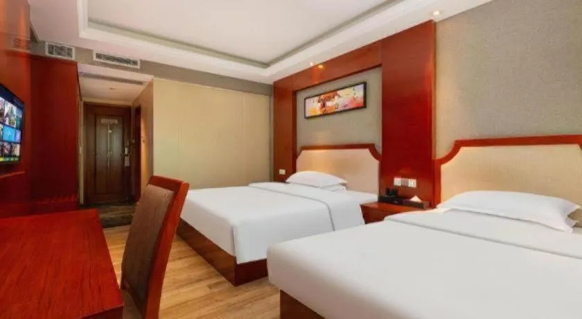 Bed in Borrman Hotel Guangzhou Tianhe Tangdong Subway Station Convention and Exhibition Center