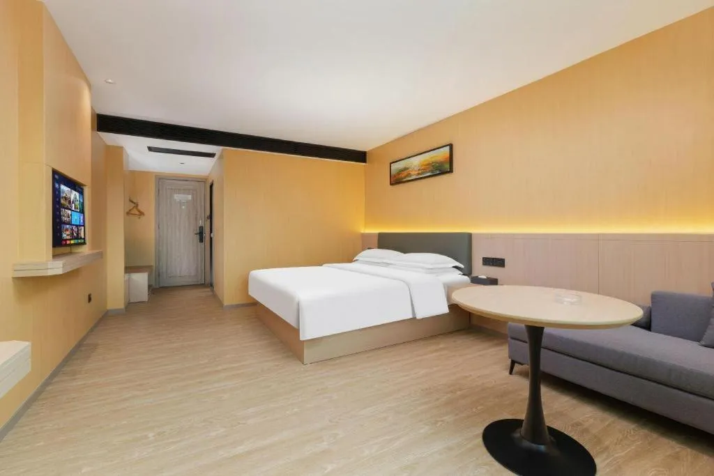 Bed in Borrman Hotel Guangzhou Tianhe Tangdong Subway Station Convention and Exhibition Center