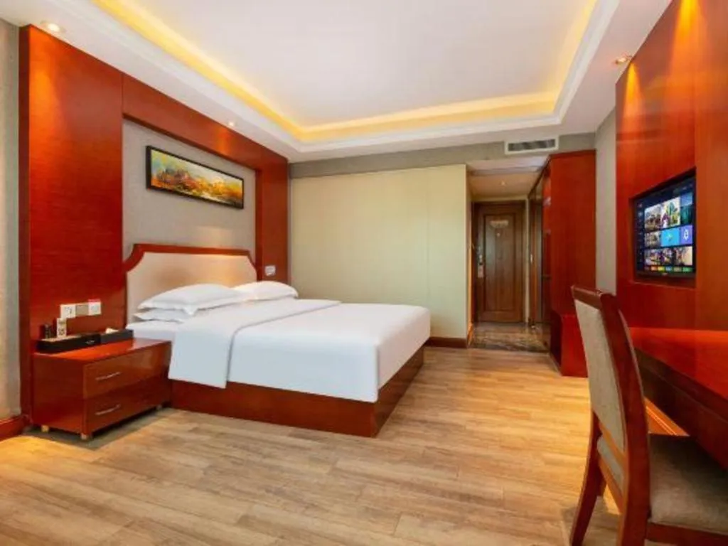 Bed in Borrman Hotel Guangzhou Tianhe Tangdong Subway Station Convention and Exhibition Center