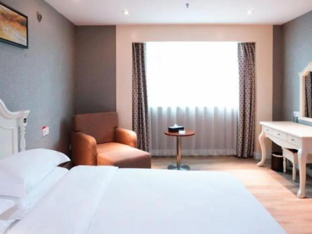 Bed in Borrman Hotel Guangzhou Tianhe Tangdong Subway Station Convention and Exhibition Center