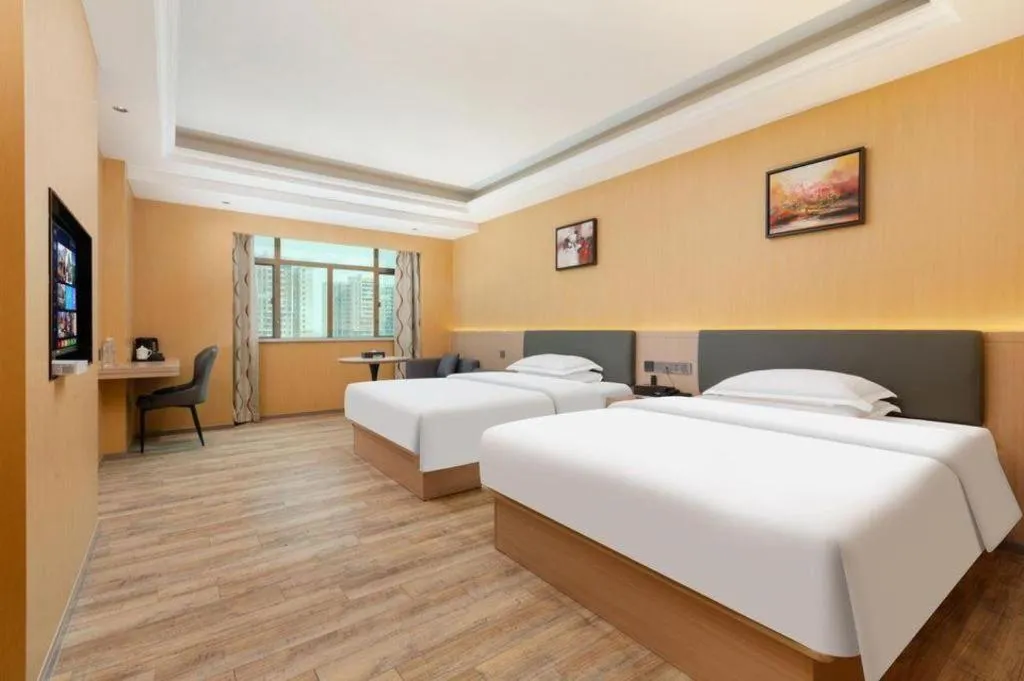 Bed in Borrman Hotel Guangzhou Tianhe Tangdong Subway Station Convention and Exhibition Center