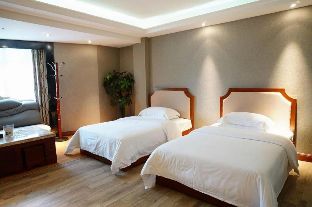 Bed in Borrman Hotel Guangzhou Tianhe Tangdong Subway Station Convention and Exhibition Center