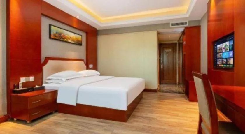 Bed in Borrman Hotel Guangzhou Tianhe Tangdong Subway Station Convention and Exhibition Center