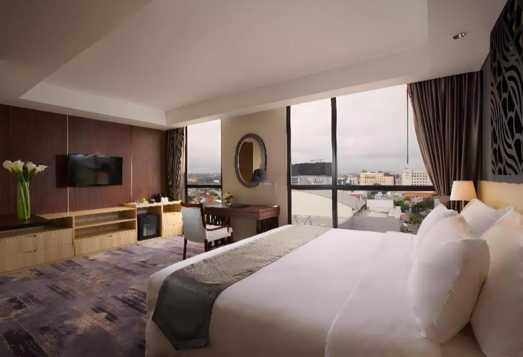 Bed in Hotel Grandhika Pemuda