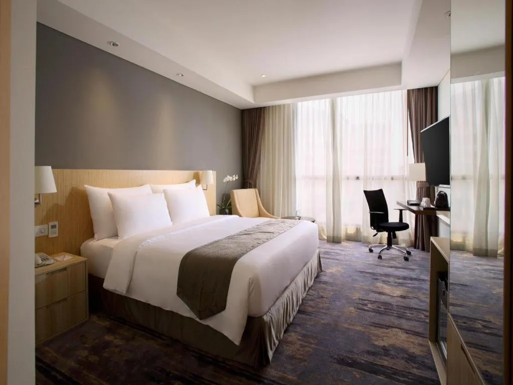 Bed in Hotel Grandhika Pemuda