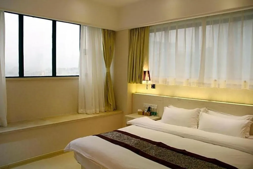 Bed in Chuanghui Business Hotel