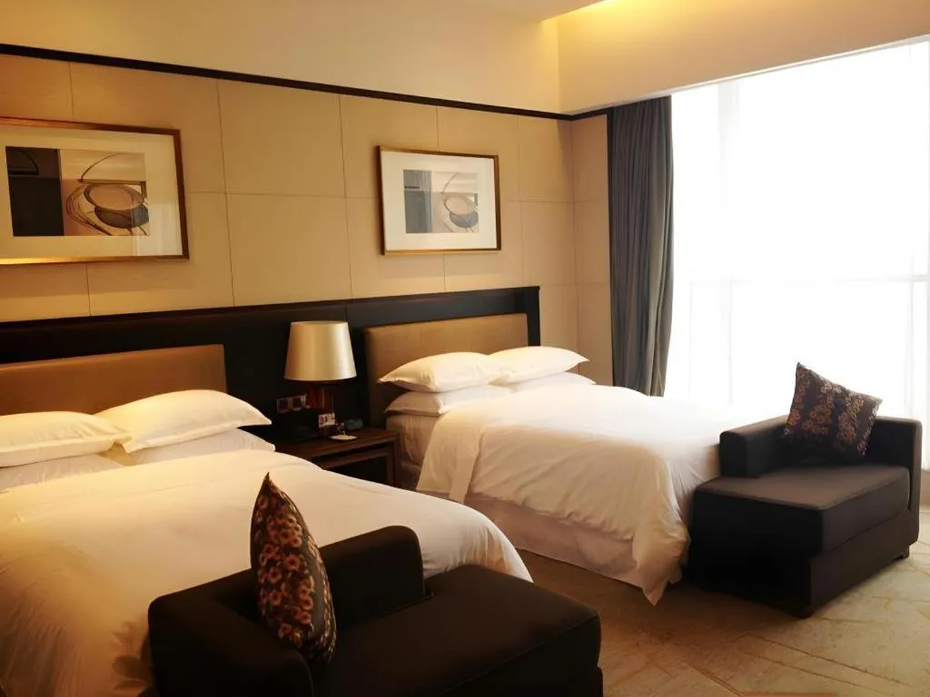 Bed in Chuanghui Business Hotel