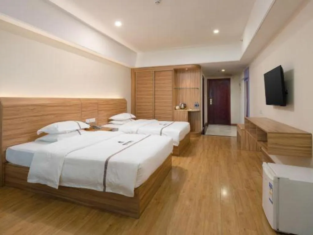 Bed in Chuanghui Business Hotel