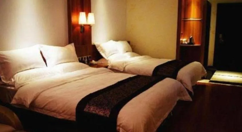 Bed in Chuanghui Business Hotel